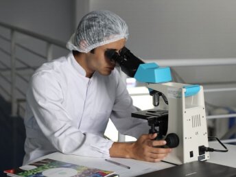 A man using microscope