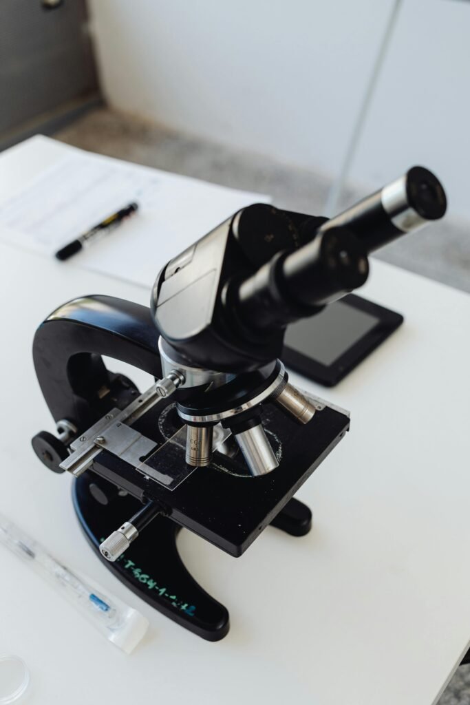 pexels-photo-8539727-8539727 High-quality close-up image of a microscope on a lab table, ideal for science or research themes.
